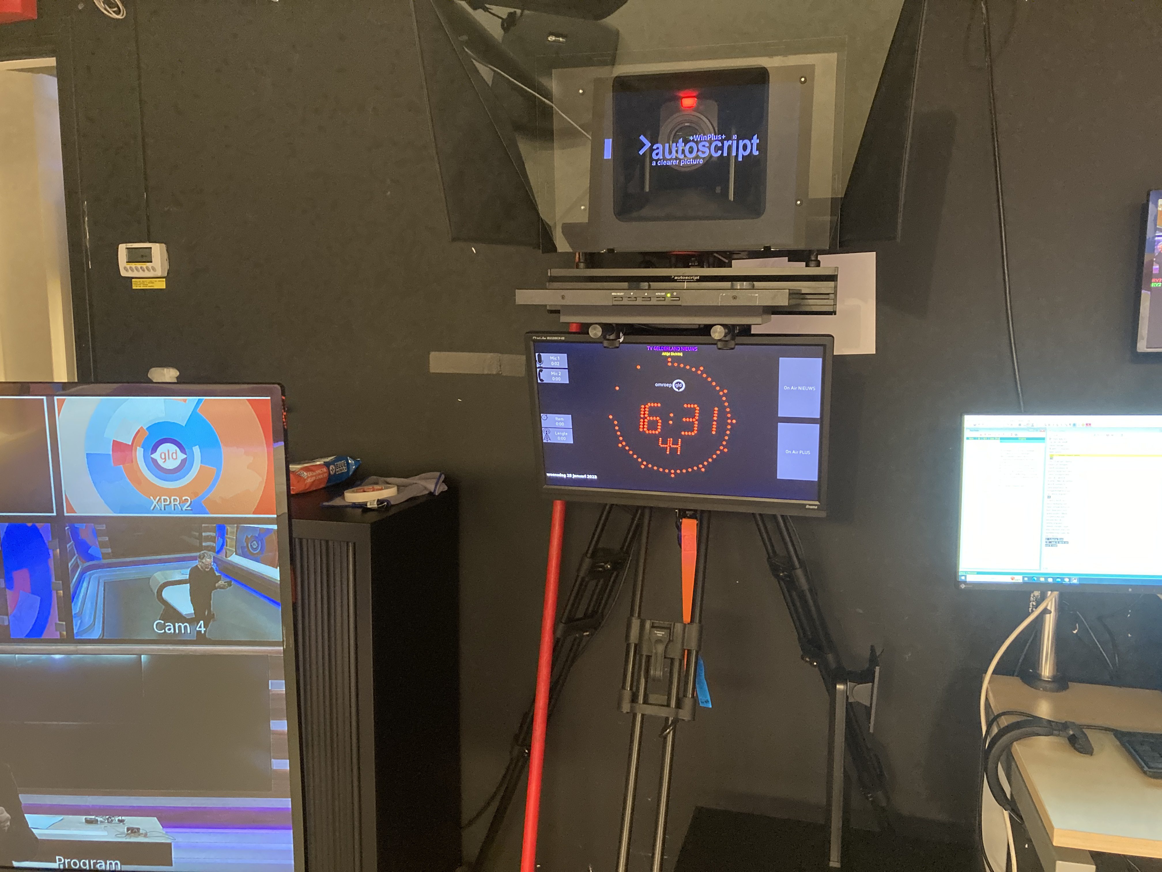 Camera rig with teleprompter and OnAirScreen timer in a television studio